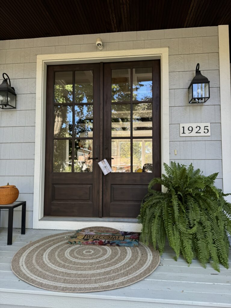 Door hanger marketing flyer placed on a residential front door